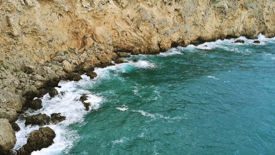 The waves crashing on the shore