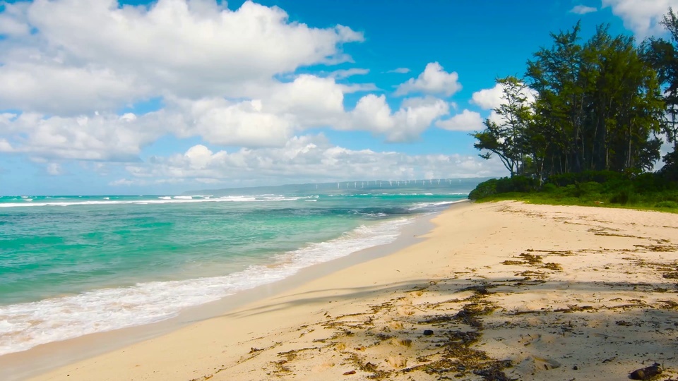 Blue sky, white clouds and blue waves beach