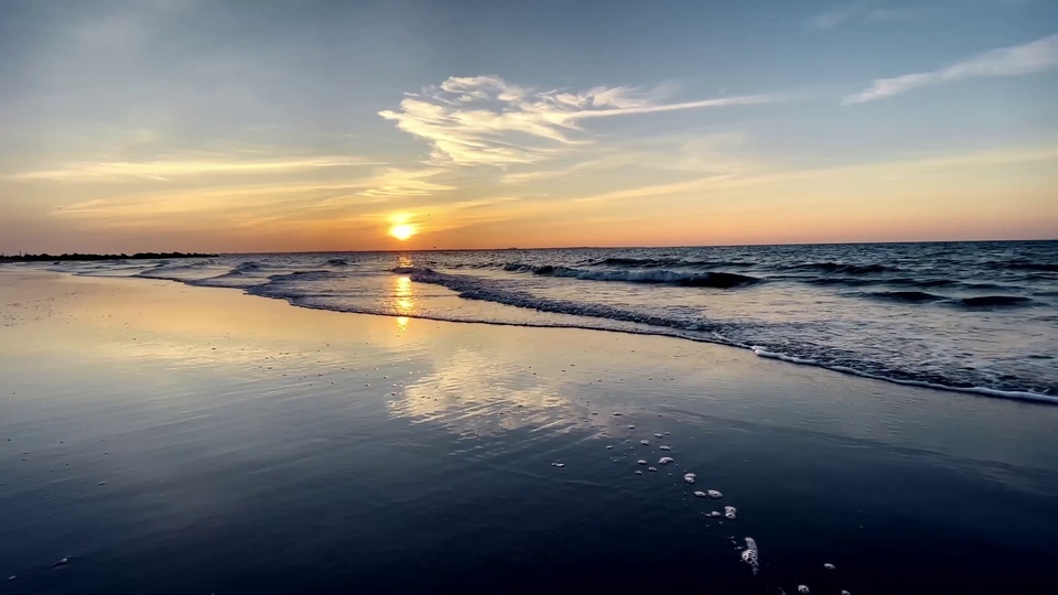 Beach waves at dusk