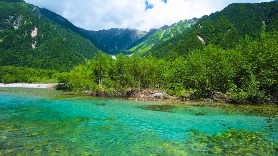 The clear water at the foot of the mountain