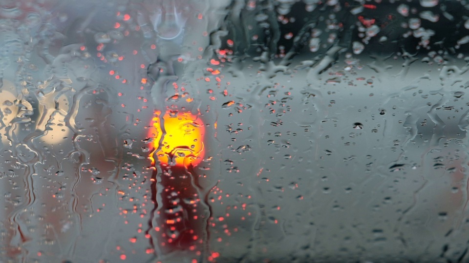 The rain and snow on the winter window