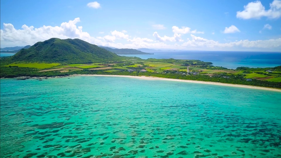 Aerial photography of green island in the sea